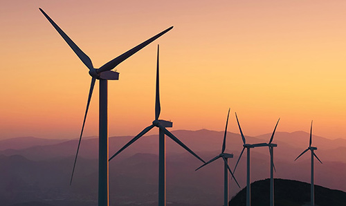 wind turbines at sunset