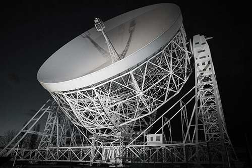 Old black and white photo of a 76-metre diameter telescope