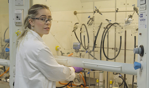 Charlotte, a postgraduate researcher, in a lab