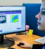 Female looking at computer screen