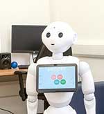 A white robots in a computer lab 
