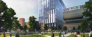 Tall silver glass building that's set in a large garden with people walking around