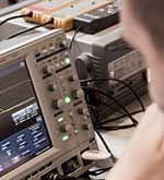 Man looking at equipment with digital readout