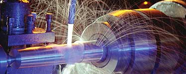 Large blue machine grinding metal