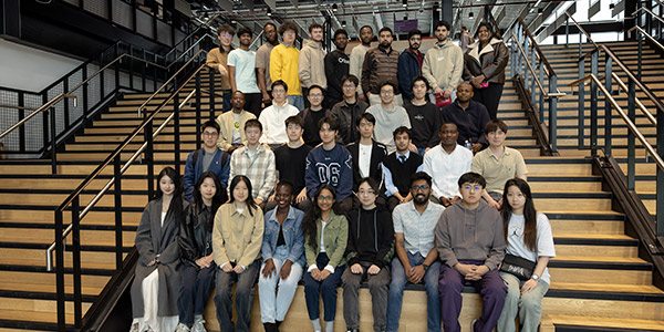 group of master's students in the Nancy Rothwell Building
