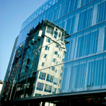 Reflection of a building in some windows