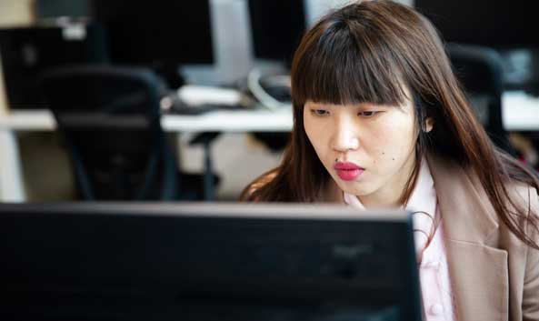 Female intensely looking at a computer screen