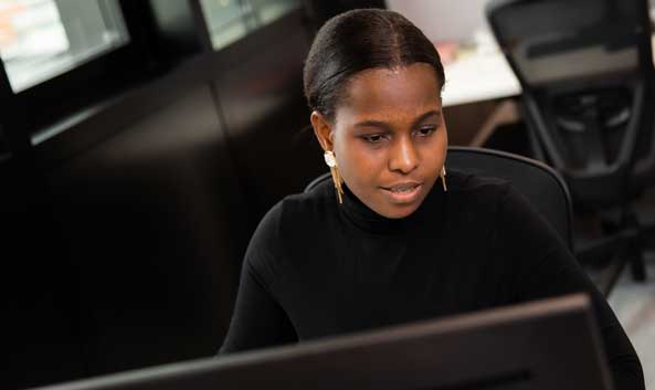 Female looking at a computer screen