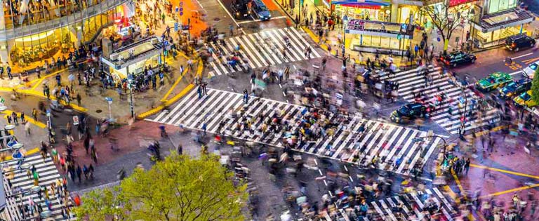 Busy road crossing in the centre of Tokyo at night