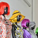 Clothed mannequins with brightly coloured wigs